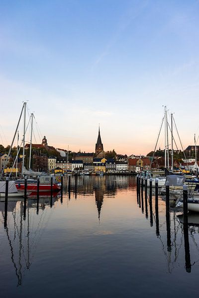 View of Flensburg church between boats | Travel photography by Kelsey van den Bosch