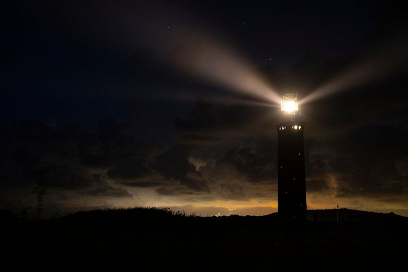 Lighthouse in the dunes with lightbeams at night by Sjoerd van der Wal Photography