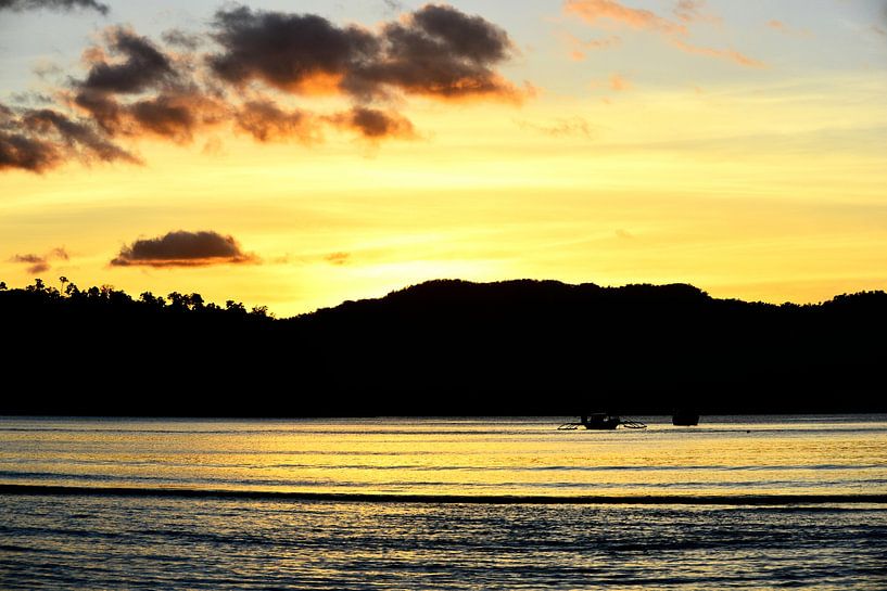 A golden glow on Palawan beach by Frank Photos