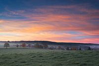 Sunrise in the Belgian Ardennes on a cold autumn morning.