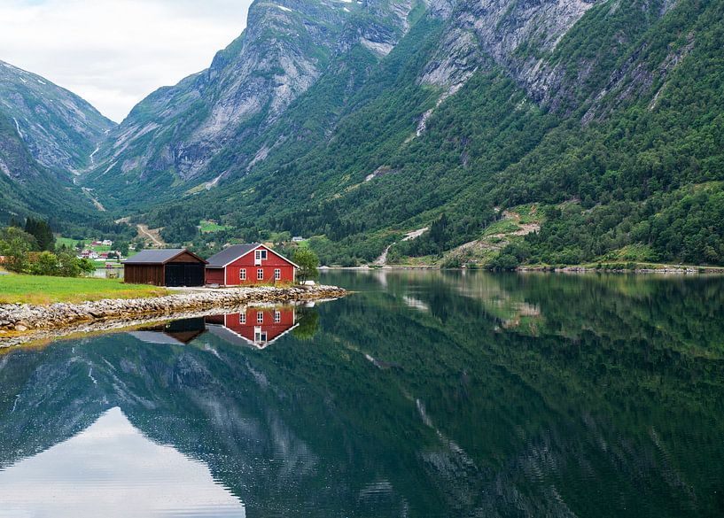red wooden house at norway fjord by ChrisWillemsen