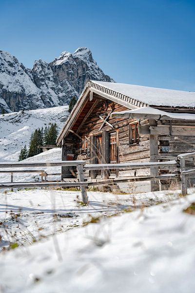 Alpine hut in the snow with Allgäu mountains by Leo Schindzielorz