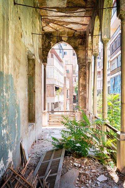 Corridor with city view in abandoned palace. by Roman Robroek - Photos of Abandoned Buildings