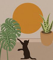 Eine niedliche Katze, die nach Blättern greift