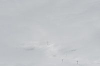 Cable cars in dense clouds