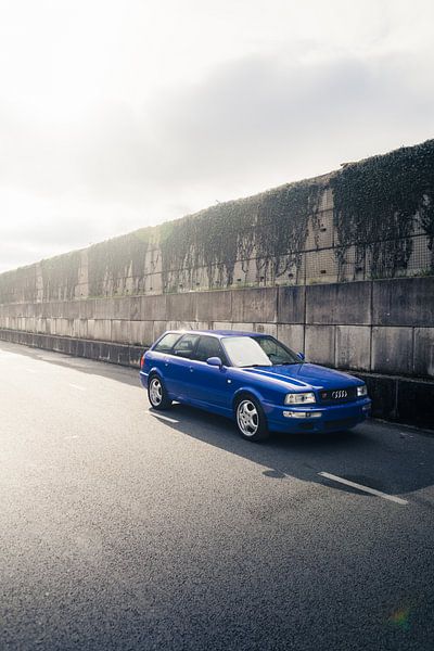 Blue Audi RS2 on Long Road by Historic Wall by Sebastiaan van 't Hoog