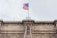 Brooklyn Bridge top with moon and American flag
