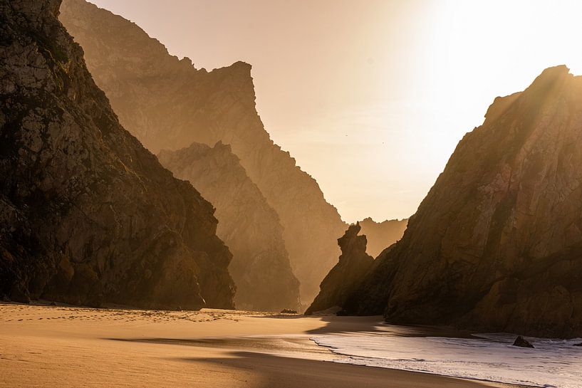 Rock silhouettes on the beach. by Axel Weidner