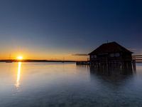 A boathouse in the sunset