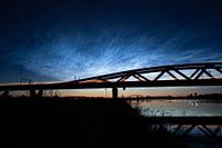 Luminous night clouds at the Hanzeboog railway bridge between Hattem and Zwolle