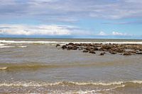 Waves of the sea and the blue sky