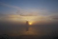 Zonsopkomst aan het water