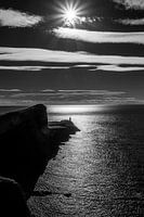 Das Licht des Leuchtturms am Himmel