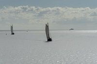 Two sailing ships on the Wadden Sea