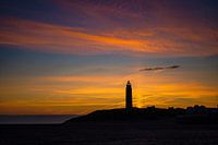 Leuchtturm von Texel mit Sonnensäule bei Sonnenaufgang
