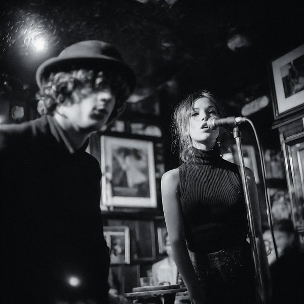 young woman sings in a band by Joost Berndes