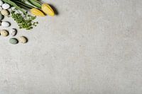 Yellow tulips and decorative eggs