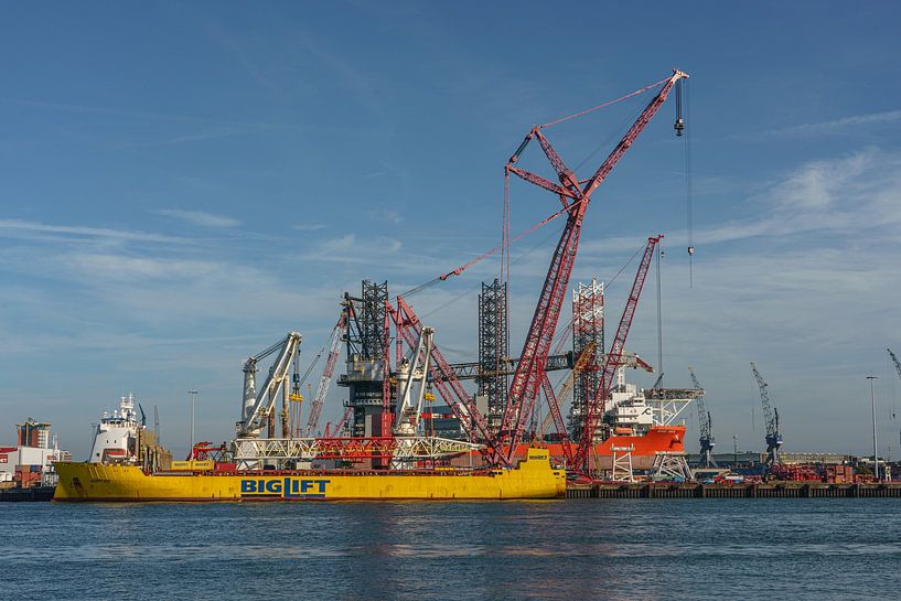 Site of Mammoet with pair of huge cranes. by Jaap van den Berg