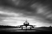 Old Mirage 5 under dark clouds