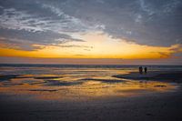 Golden reflection on the beach of Ameland