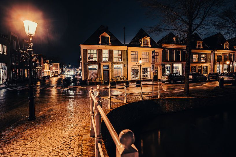 Rainy winter evening canal scene historic small town by Jan Willem de Groot Photography