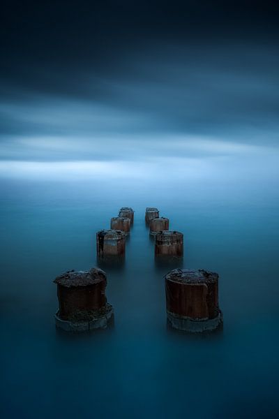 Minimalism around wooden pillars by Yannick Lefevre