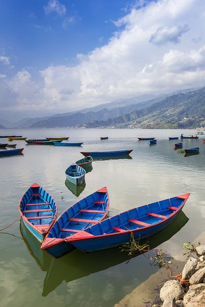 Traditional wooden boats on the Phewa lake in Pokhara, Nepal by Marc Venema