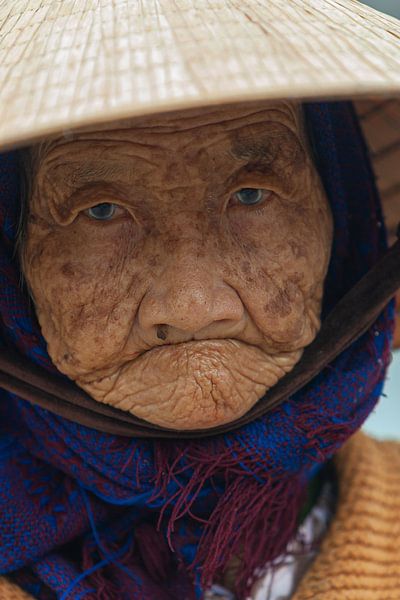 Portrait of an old lady with cataract, Vietnam by Henk Meijer Photography