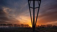 sunrise with high voltage pylon