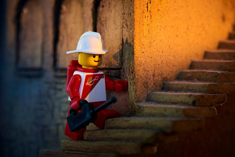 Lego male on a stone staircase by Jenco van Zalk