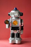Vintage toy robot on red