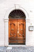 Wooden front door brown and white in Rome