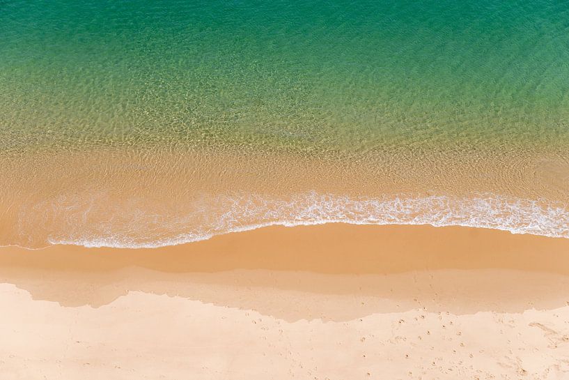 Tranquil image of a beautiful stretch of Portuguese beach and green blue sea by Marit Hilarius