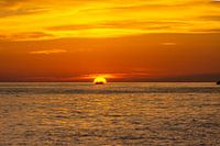 Fisherman heads home during sunset