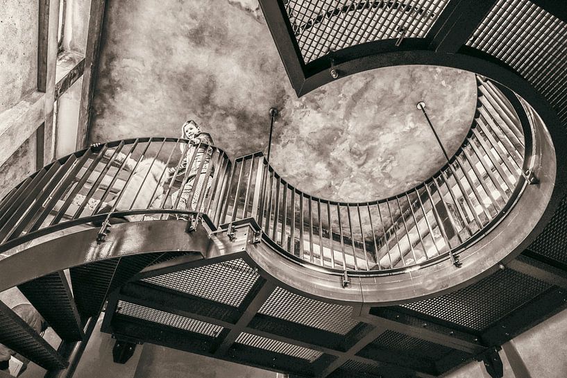 Swinging round industrial stairs in old building, in vintage colours by Jan Willem de Groot Photography