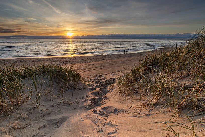 Path through the dunes leads to the beach where you can enjoy the setting sun. by Bram Lubbers