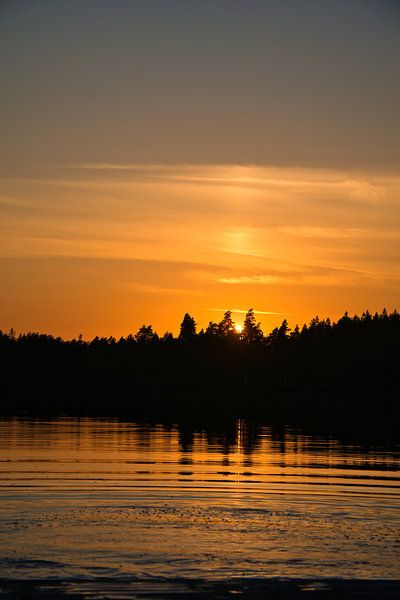 Sunrise over a lake in Sweden, at dawn by Martin Köbsch