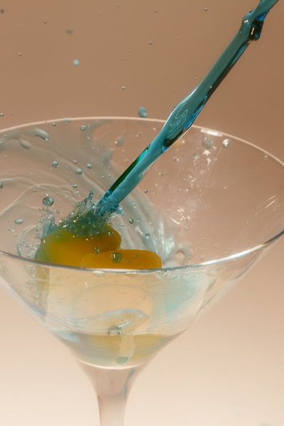 Blue alcohol meets orange ice cubes by Marc Heiligenstein