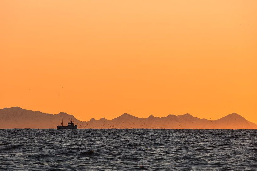 Silhouette of a fishing boat at sunset - Vesteralen, Norway by Martijn Smeets