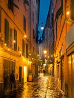 Rainy alley in Genoa, Italy at night