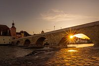 Stone bridge in Regensburg with sun star