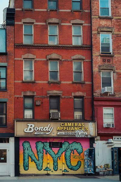 NYC Urban Spirit - Graffiti in front of a brick facade by NZME Photography