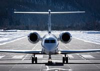 Business Jet - Gulfstream G550 - slowing down on the runway.