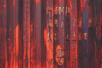 Colourful, weathered container