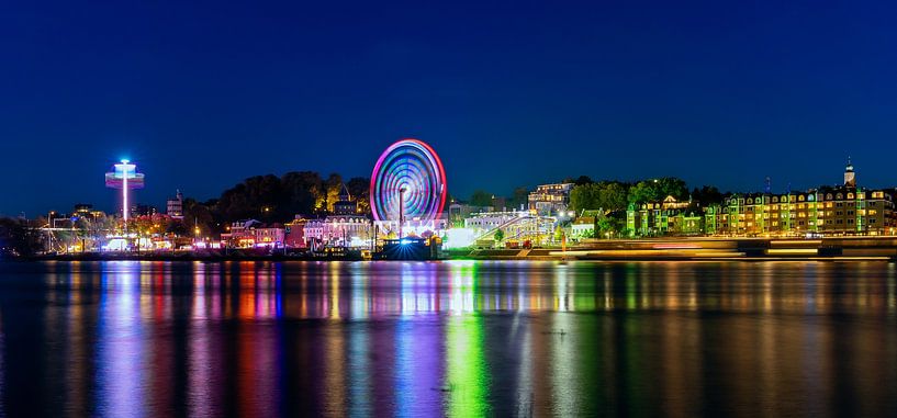 Fair on Nijmegen's Waalkade during blue hour (night) by Johannes Jongsma