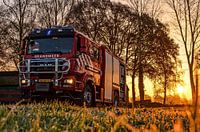 Brandweer bij zonsopkomst en vorst