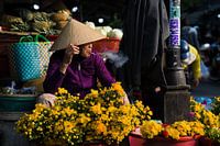 Streetportret of a Vietnamese woman with conical hat