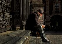 Old man on the steps of Cathedral of Catania