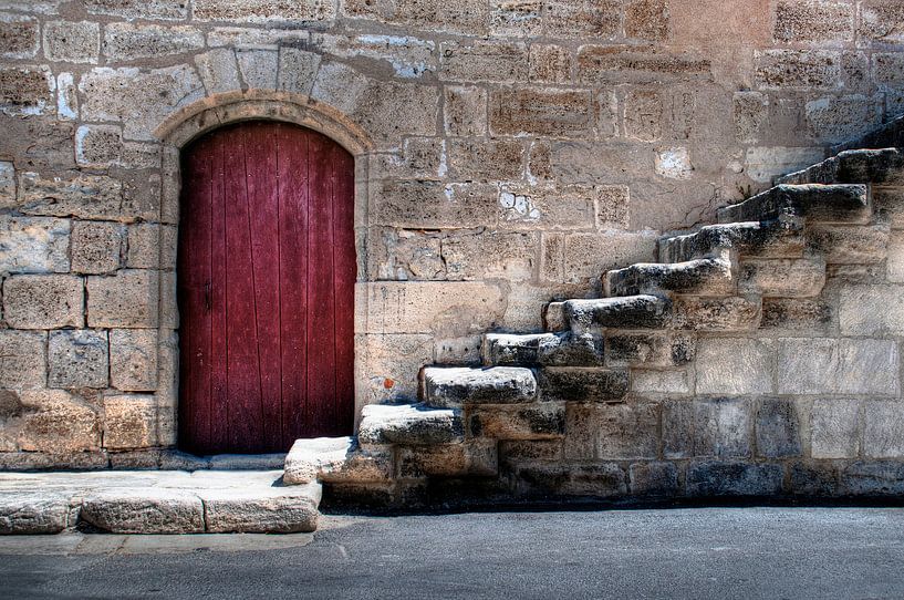 Old city wall with red door and stairs by Tammo Strijker