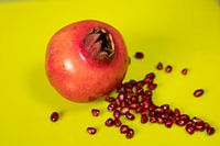 Pomegranate on lime background